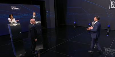 Flávio Bolsonaro (PL) e Lula (PT) se enfrentam no debate da Band neste domingo, 18 Foto: Reprodução/Band TV